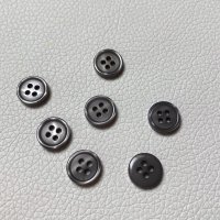Miniatura de foto de Botón 4 agujeros gris 11mm