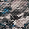 Miniatura de foto de Acolchado gris con manchas negras y azules