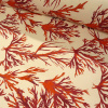 Miniatura de foto de Loneta estampado ramas rojas y granates, fondo beige