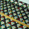 Miniatura de foto de Raso negro estampado calaveras multicolor