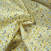 Miniatura de foto de Loneta estampado manchas amarillo, negro, naranja, gris