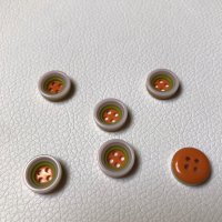 Miniatura de foto de Botón malva y naranja 13mm.