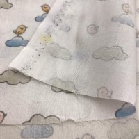 Miniatura de foto de Popelín estampado nubes y pajaritos azul