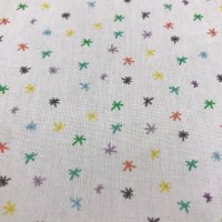 Miniatura de foto de Popelín estampado estrellas asteriscos de colores