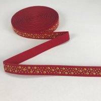 Miniatura de foto de Goma roja tachas doradas roja 25mm