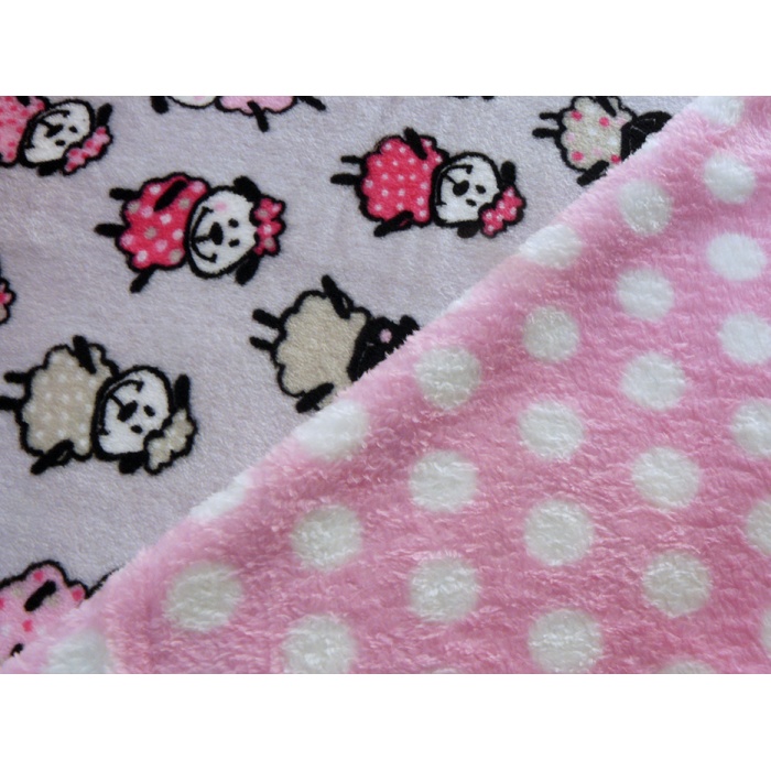 Foto de Coralina doble cara. Ovejas y lunares rosas. Tiene algodón a juego.