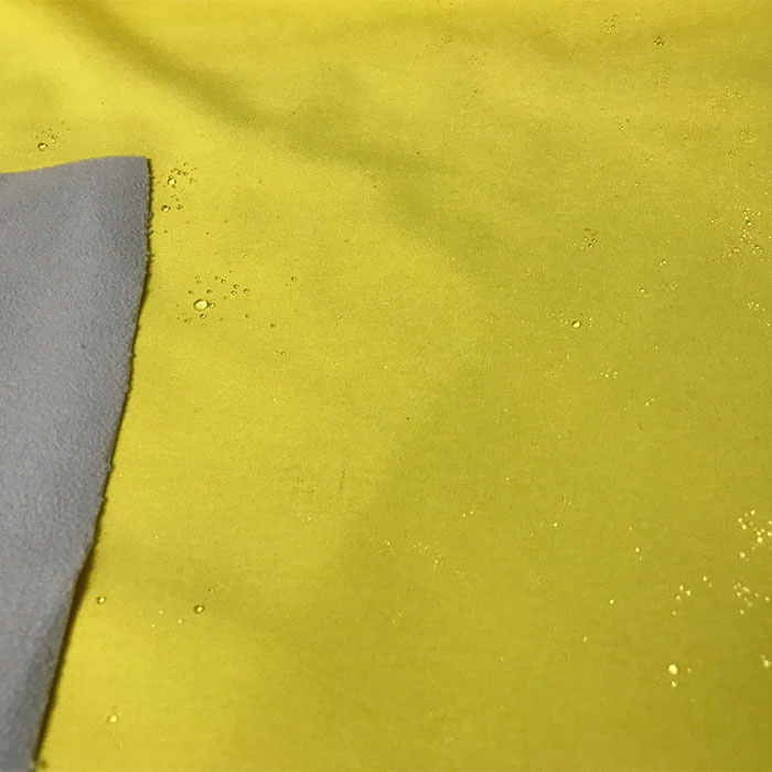 Foto de Impermeable neopreno liso doble cara amarillo